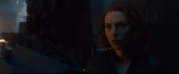 Movie still from “Avengers: Age of Ultron” (2015), directed by Joss Whedon – A person in a dark room; Close Up shot, Over the shoulder angle