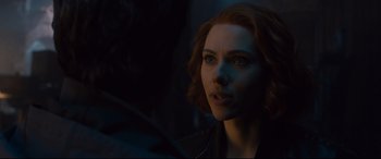 Movie still from “Avengers: Age of Ultron” (2015), directed by Joss Whedon – A person in a dark room; Close Up shot, Over the shoulder angle