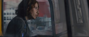 Movie still from “Avengers: Age of Ultron” (2015), directed by Joss Whedon – A woman sitting in a car looking out the window; Close Up shot, Over the shoulder angle