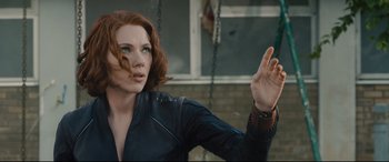 Movie still from “Avengers: Age of Ultron” (2015), directed by Joss Whedon – A person holding something in their hand; Close Up shot, Over the shoulder angle