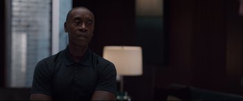 Movie still from “Avengers: Endgame” (2019), directed by Anthony Russo – A man sitting in front of a lamp in a dark room; Close Up shot, Over the shoulder angle