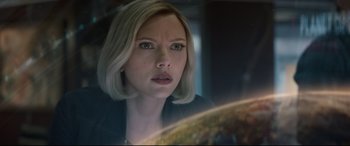 Movie still from “Avengers: Endgame” (2019), directed by Anthony Russo – A person with short blonde hair; Close Up shot, Over the shoulder angle