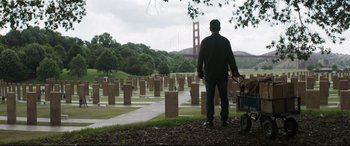 Movie still from “Avengers: Endgame” (2019), directed by Anthony Russo – A man standing in a cemetery with a child in a wagon; Wide shot, Over the shoulder angle