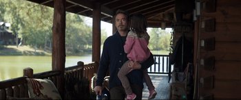 Movie still from “Avengers: Endgame” (2019), directed by Anthony Russo – A man holding a little girl in his arms; Medium shot, Over the shoulder angle