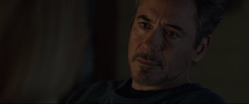 Movie still from “Avengers: Endgame” (2019), directed by Anthony Russo – A man's face in a dark room; Close Up shot, Over the shoulder angle