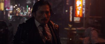 Movie still from “Avengers: Endgame” (2019), directed by Anthony Russo – A man in a suit and tie standing in the dark; Close Up shot, Low angle