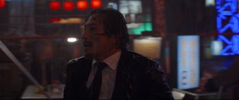 Movie still from “Avengers: Endgame” (2019), directed by Anthony Russo – A person wearing a suit and tie; Close Up shot, Low angle