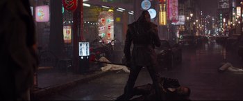 Movie still from “Avengers: Endgame” (2019), directed by Anthony Russo – A man in a trench coat standing in the rain; Wide shot, Over the shoulder angle