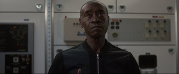 Movie still from “Avengers: Endgame” (2019), directed by Anthony Russo – A man in a black jacket is looking at the camera; Close Up shot, Low angle