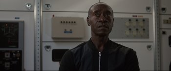 Movie still from “Avengers: Endgame” (2019), directed by Anthony Russo – A man standing in a room looking up at the ceiling; Close Up shot, Low angle