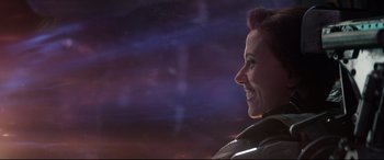 Movie still from “Avengers: Endgame” (2019), directed by Anthony Russo – A person smiling with the sky in the background; Close Up shot, Over the shoulder angle