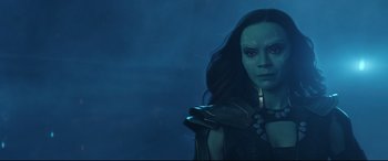 Movie still from “Avengers: Endgame” (2019), directed by Anthony Russo – A person with long black hair; Close Up shot, Over the shoulder angle