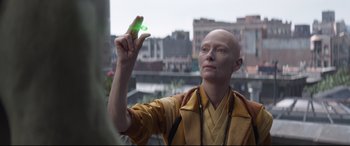 Movie still from “Avengers: Endgame” (2019), directed by Anthony Russo – A bald man holding a green object in his hand; Close Up shot, High angle