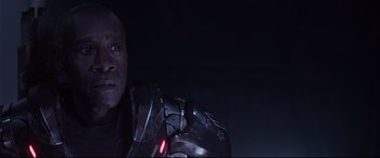 Movie still from “Avengers: Endgame” (2019), directed by Anthony Russo – A person holding a helmet; Close Up shot, Low angle