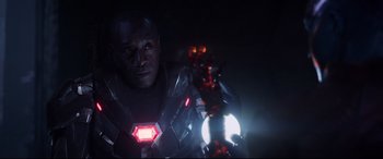 Movie still from “Avengers: Endgame” (2019), directed by Anthony Russo – A man in a suit with a light on his head; Close Up shot, Over the shoulder angle