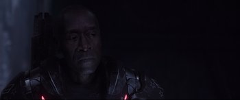 Movie still from “Avengers: Endgame” (2019), directed by Anthony Russo – A man in a black shirt is holding a red object in front of him; Close Up shot, Low angle