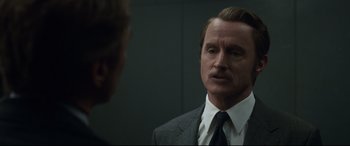 Movie still from “Avengers: Endgame” (2019), directed by Anthony Russo – A person wearing a suit and a tie; Close Up shot, Over the shoulder angle