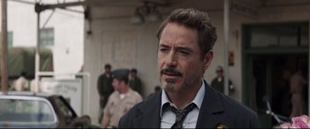 Movie still from “Avengers: Endgame” (2019), directed by Anthony Russo – A person wearing a suit and a tie; Close Up shot, Over the shoulder angle