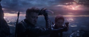 Movie still from “Avengers: Endgame” (2019), directed by Anthony Russo – Two men in black leather jackets holding a knife; Medium shot, Low angle