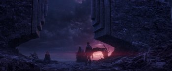 Movie still from “Avengers: Endgame” (2019), directed by Anthony Russo – A man and a woman standing in front of a stone wall; Extreme Wide shot, Low angle
