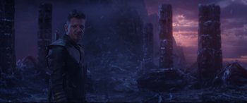 Movie still from “Avengers: Endgame” (2019), directed by Anthony Russo – A man standing in front of a mountain at night time; Medium shot, Over the shoulder angle