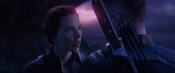 Movie still from “Avengers: Endgame” (2019), directed by Anthony Russo – A person holding a gun; Close Up shot, Over the shoulder angle