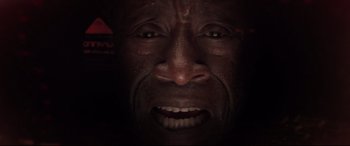 Movie still from “Avengers: Endgame” (2019), directed by Anthony Russo – A man's face with a dark background; Extreme Close Up shot, Overhead angle