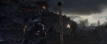 Movie still from “Avengers: Endgame” (2019), directed by Anthony Russo – A group of people standing on top of a hill; Wide shot, Low angle
