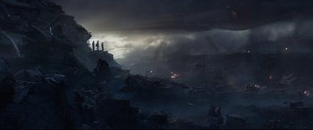 Movie still from “Avengers: Endgame” (2019), directed by Anthony Russo – A group of people standing on top of a cliff; Extreme Wide shot, Low angle