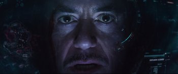 Movie still from “Avengers: Endgame” (2019), directed by Anthony Russo – A man's face with a lot of light coming on; Extreme Close Up shot, Low angle