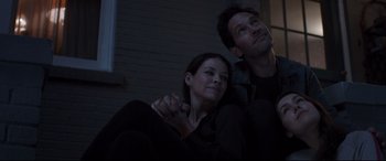 Movie still from “Avengers: Endgame” (2019), directed by Anthony Russo – A man and a woman sitting next to each other in the dark; Medium shot, Low angle