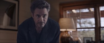 Movie still from “Avengers: Endgame” (2019), directed by Anthony Russo – A person wearing a suit and tie; Close Up shot, Over the shoulder angle
