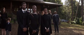 Movie still from “Avengers: Endgame” (2019), directed by Anthony Russo – A group of people standing next to each other in front of a building; Medium shot, Low angle