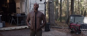 Movie still from “Avengers: Endgame” (2019), directed by Anthony Russo – A man standing in front of some trees; Medium shot, Over the shoulder angle