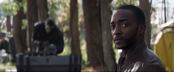 Movie still from “Avengers: Endgame” (2019), directed by Anthony Russo – A man standing in front of a camera in a forest; Close Up shot, Over the shoulder angle