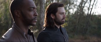 Movie still from “Avengers: Endgame” (2019), directed by Anthony Russo – A man with long hair stands next to another man with a beard; Close Up shot, Over the shoulder angle
