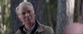 Movie still from “Avengers: Endgame” (2019), directed by Anthony Russo – An older man in a beige jacket is standing in front of a tree; Close Up shot, Over the shoulder angle