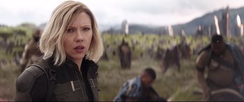 Movie still from “Avengers: Infinity War” (2018), directed by Anthony Russo – A woman standing in front of a group of people; Close Up shot, Over the shoulder angle
