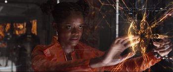 Movie still from “Avengers: Infinity War” (2018), directed by Anthony Russo – A woman in an orange shirt is looking at the camera; Close Up shot, Low angle