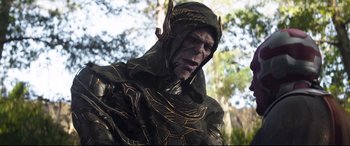 Movie still from “Avengers: Infinity War” (2018), directed by Anthony Russo – A man dressed in a costume with a tree in the background; Medium shot, Low angle
