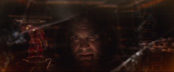 Movie still from “Avengers: Infinity War” (2018), directed by Anthony Russo – A person's face in the dark; Close Up shot, Low angle