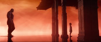 Movie still from “Avengers: Infinity War” (2018), directed by Anthony Russo – A person walking under a large structure in the sky; Extreme Wide shot, High angle