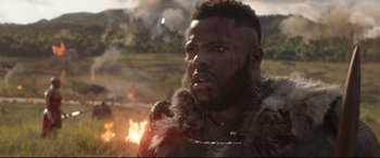 Movie still from “Avengers: Infinity War” (2018), directed by Anthony Russo – A man with a beard and a fur vest; Close Up shot, Over the shoulder angle