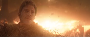 Movie still from “Avengers: Infinity War” (2018), directed by Anthony Russo – A person in a field at sunset; Close Up shot, Over the shoulder angle