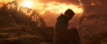 Movie still from “Avengers: Infinity War” (2018), directed by Anthony Russo – A man is standing in the middle of a pile of rubble; Medium shot, Low angle