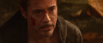 Movie still from “Avengers: Infinity War” (2018), directed by Anthony Russo – A person with blood on his face; Close Up shot, Over the shoulder angle