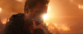 Movie still from “Avengers: Infinity War” (2018), directed by Anthony Russo – A person holding his hand up to his face; Close Up shot, Over the shoulder angle