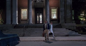 Movie still from “Awakenings” (1990), directed by Penny Marshall – A man and a woman walking down the sidewalk; Wide shot, Low angle