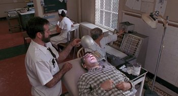 Movie still from “Awakenings” (1990), directed by Penny Marshall – A group of people sitting in a room; Wide shot, High angle