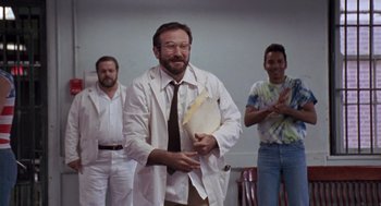 Movie still from “Awakenings” (1990), directed by Penny Marshall – A group of men standing next to each other in a room; Medium shot, Low angle